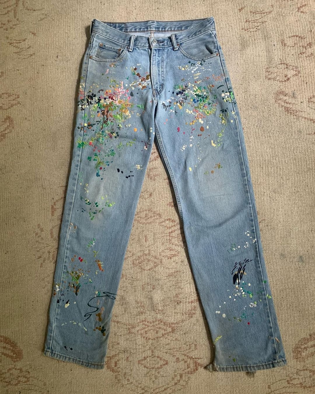 Embroidered paint splatter on vintage clothes.